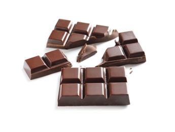 Pieces of tasty dark chocolate on white background