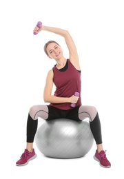 Photo of Young woman doing sports exercises isolated on white. Home fitness