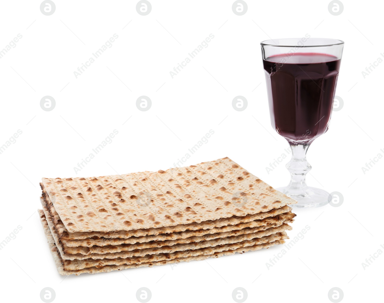 Photo of Traditional matzos and red wine on white background