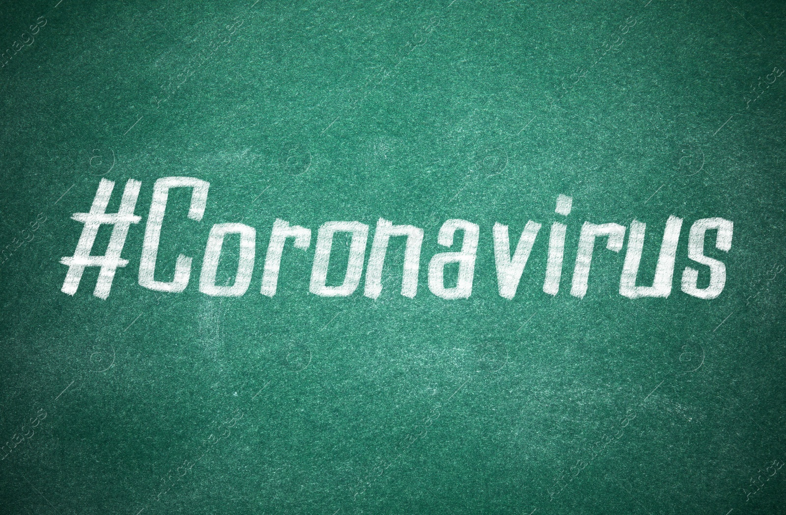 Image of Hashtag Coronavirus written with white chalk on greenboard