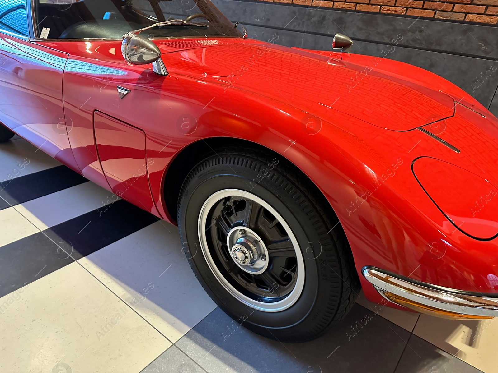 Photo of Hague, Netherlands - November 8, 2022: Beautiful view of red retro car in Louwman museum