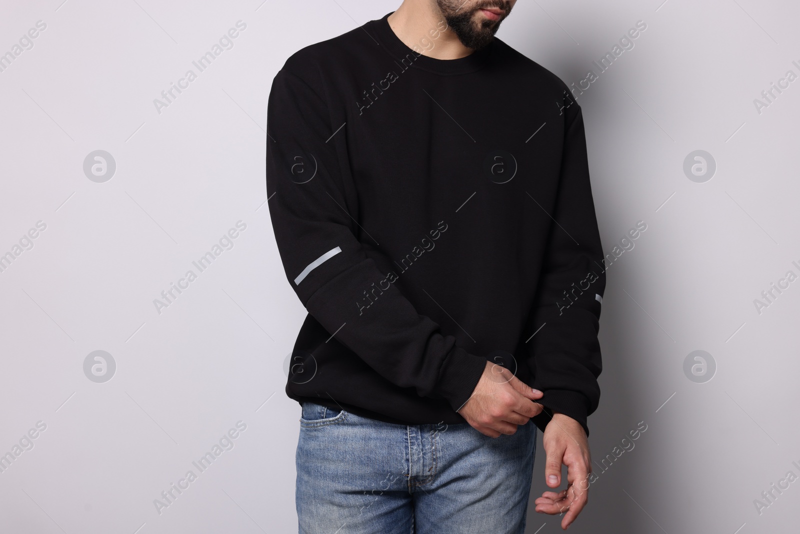 Photo of Man in stylish sweater on white background, closeup