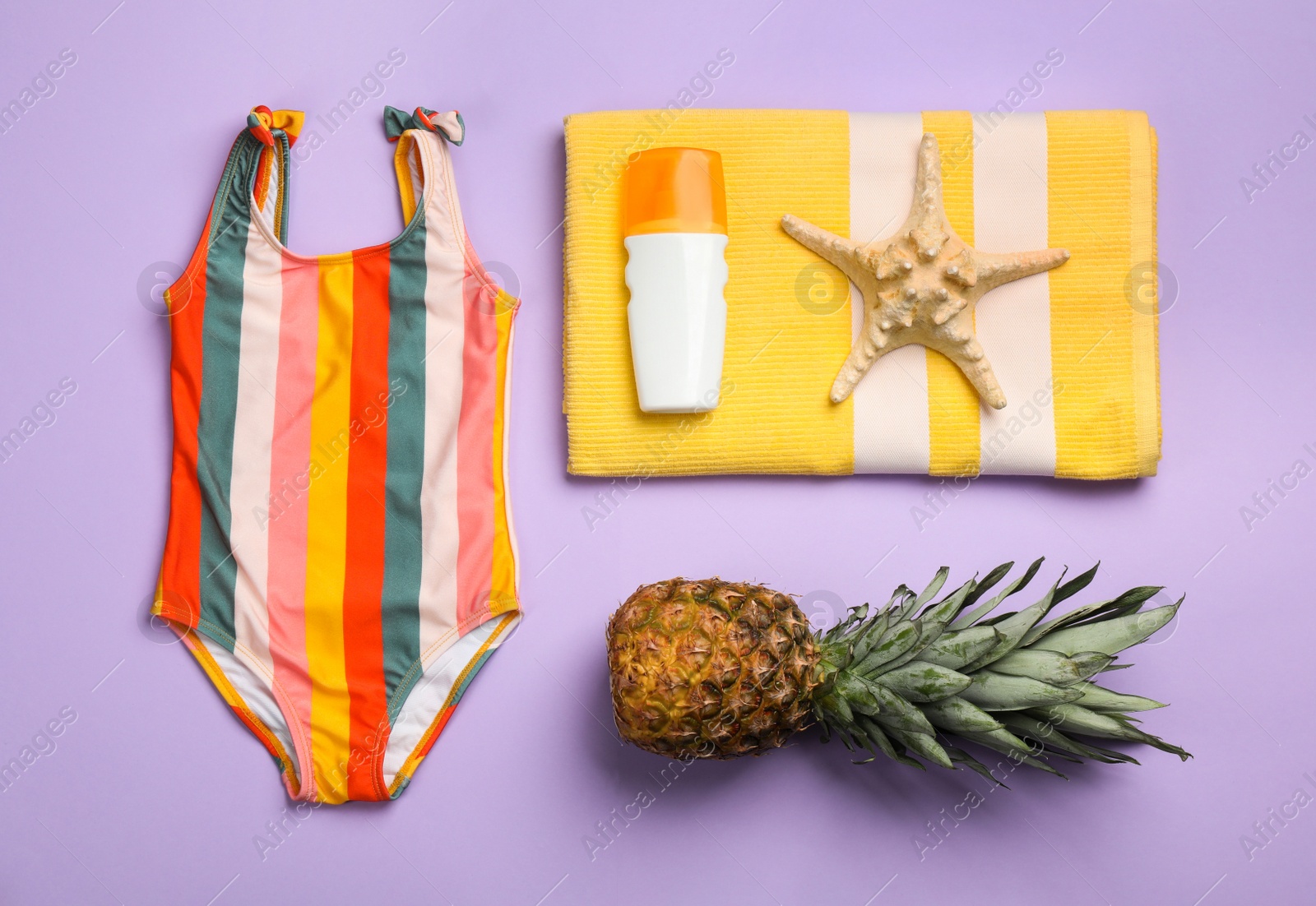 Photo of Flat lay composition with beach objects on violet background