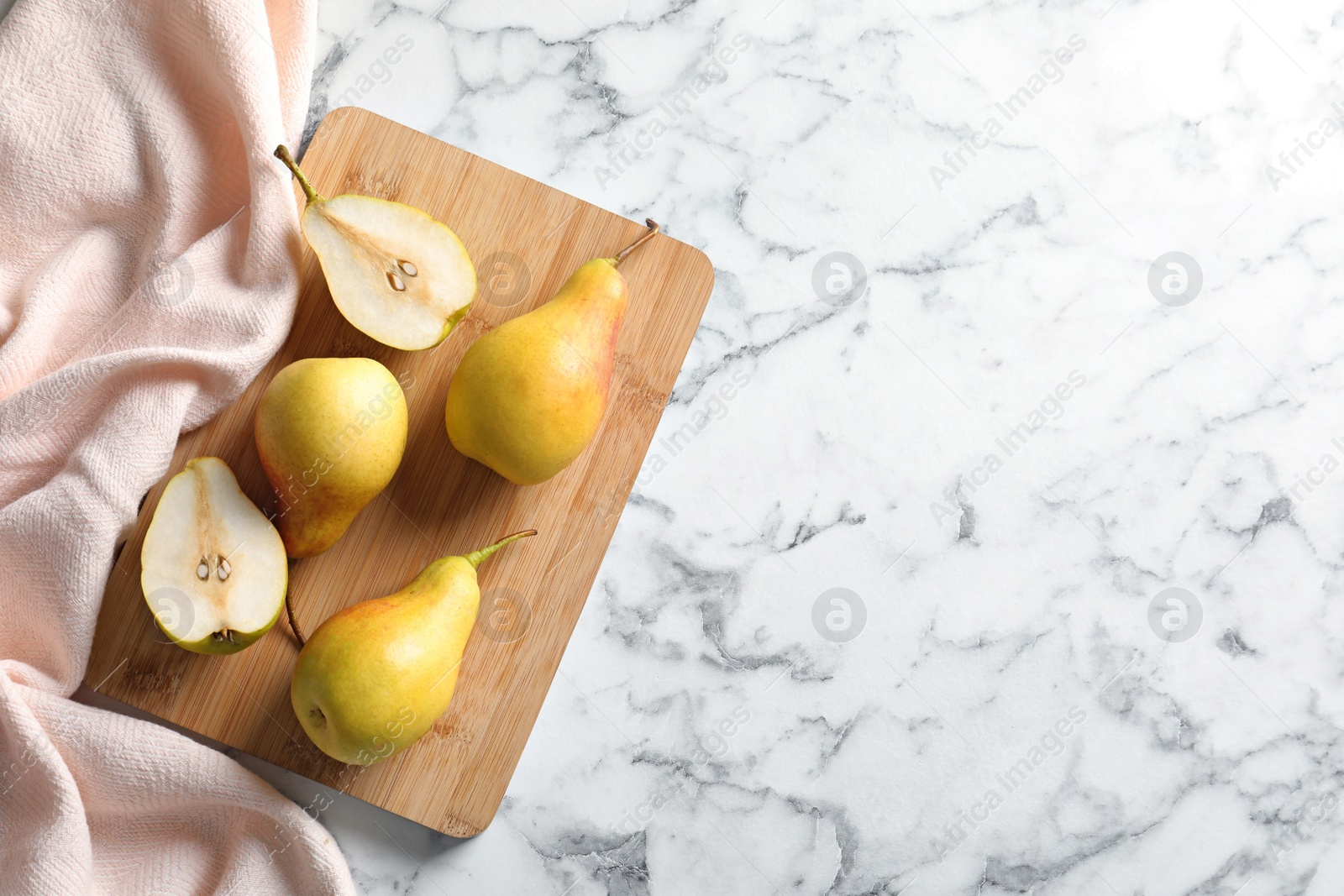 Photo of Flat lay composition with ripe pears on marble background. Space for text