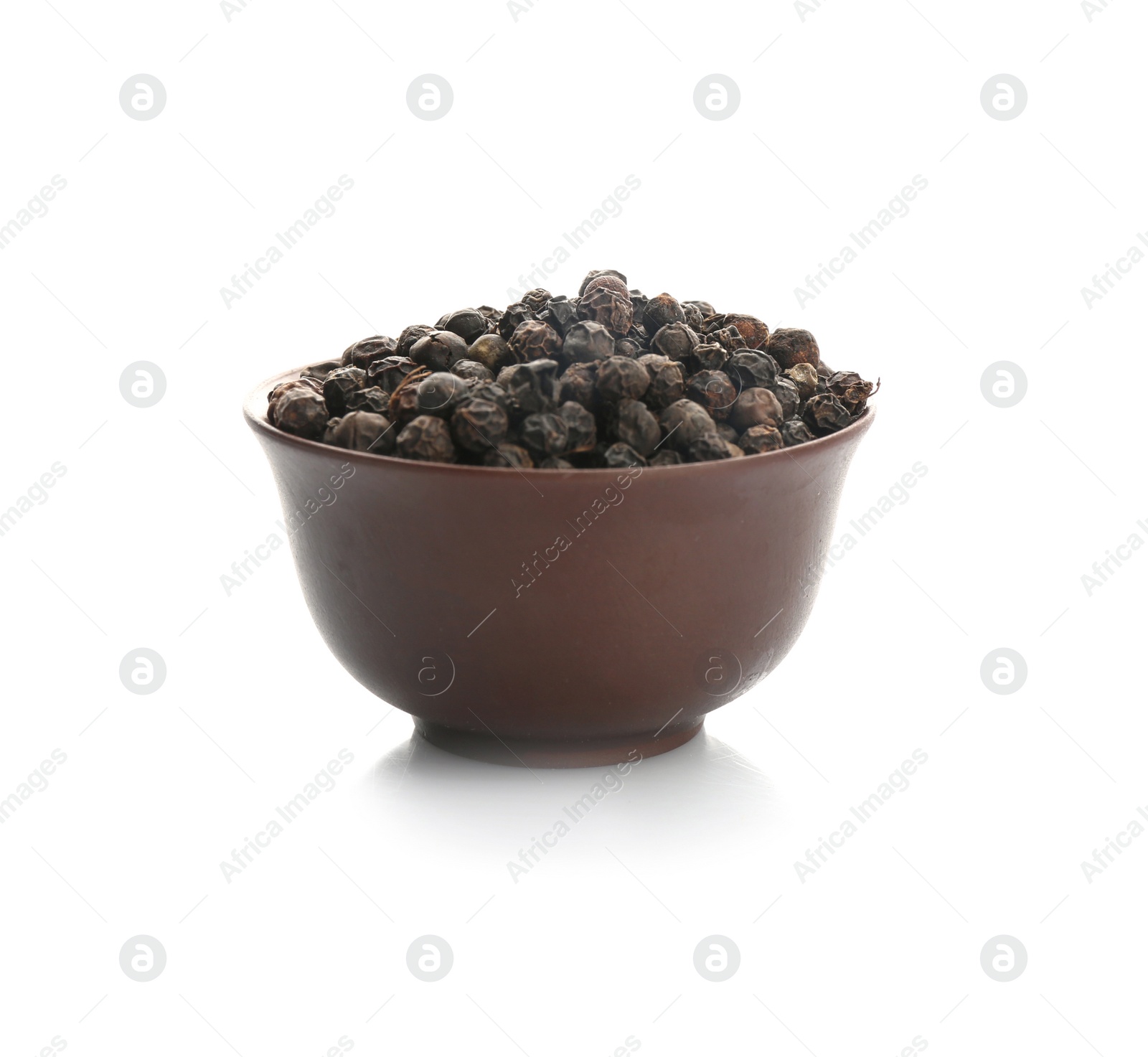 Photo of Bowl with black pepper grains on white background