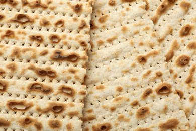 Photo of Traditional Matzos as background, top view. Pesach (Passover) celebration