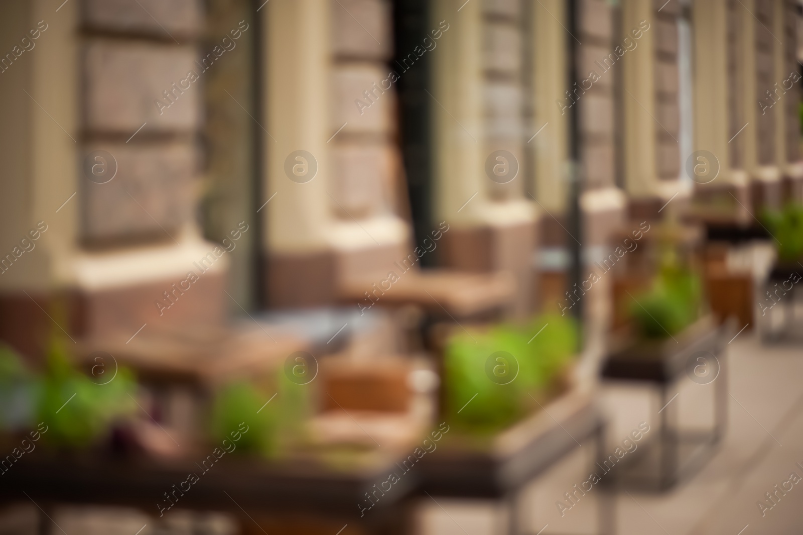 Photo of Wooden stools and tables near cafeteria outdoors, Blurred view