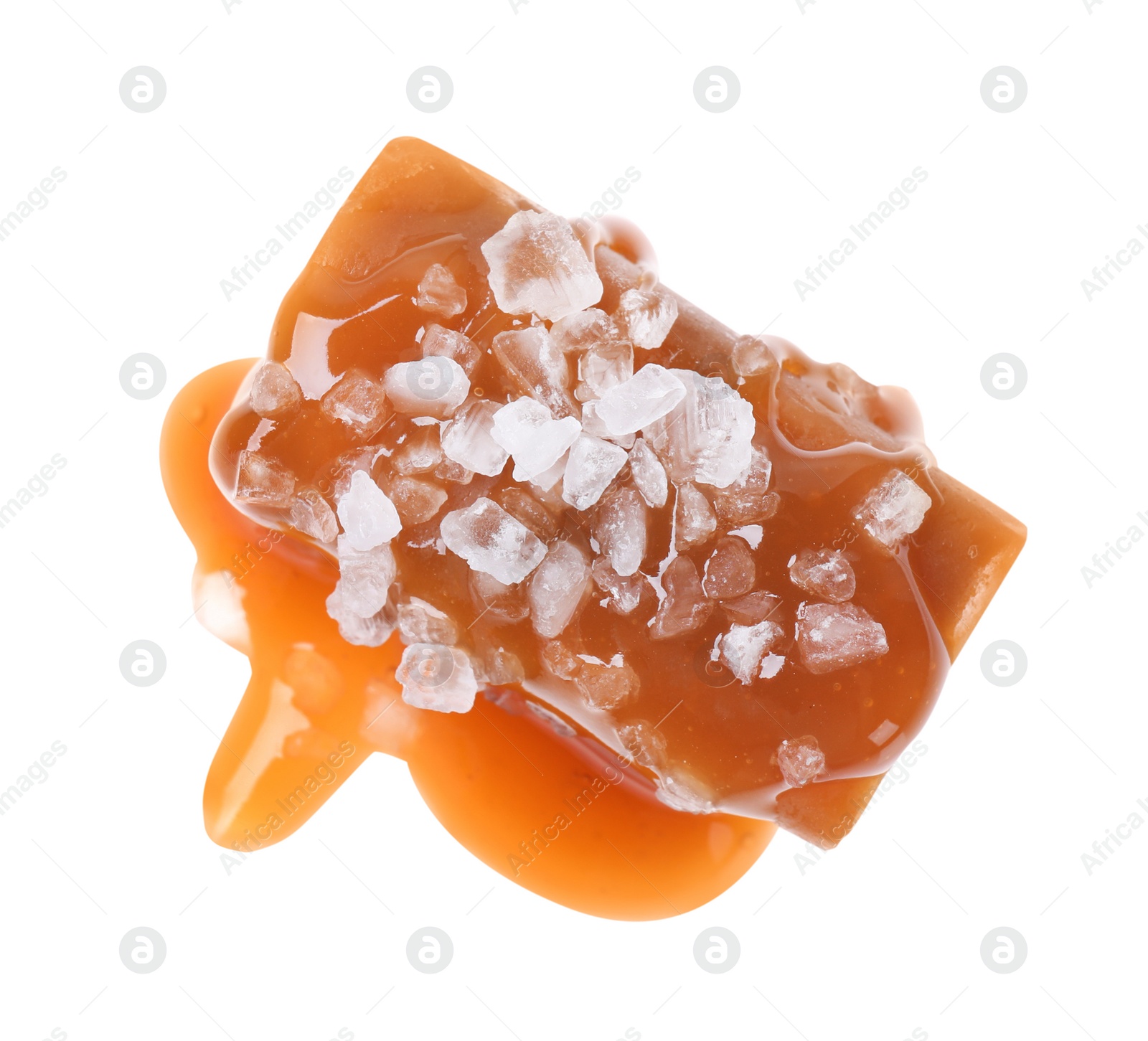 Photo of Delicious salted caramel with sauce on white background, top view