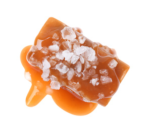 Delicious salted caramel with sauce on white background, top view