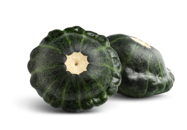 Two fresh green pattypan squashes on white background