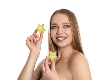 Photo of Young woman with cut carambola on white background. Vitamin rich food