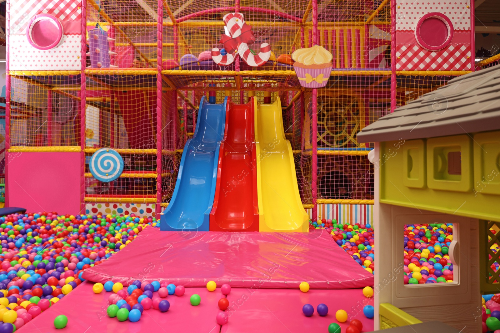 Photo of Slides and many colorful balls in ball pit