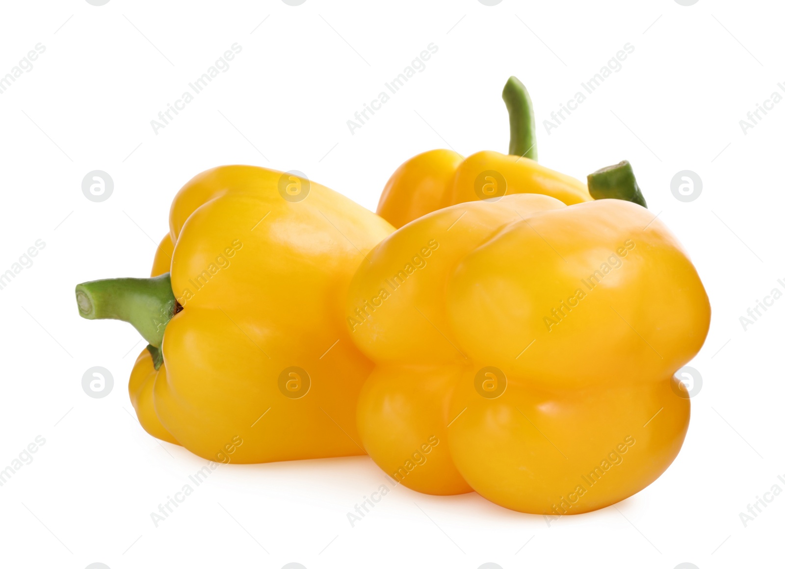 Photo of Ripe yellow bell peppers isolated on white