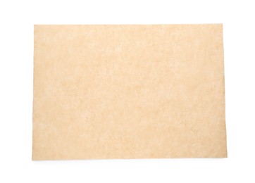 Sheet of brown baking paper on white background, top view