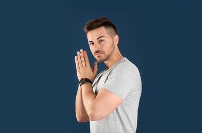 Portrait of handsome man on color background