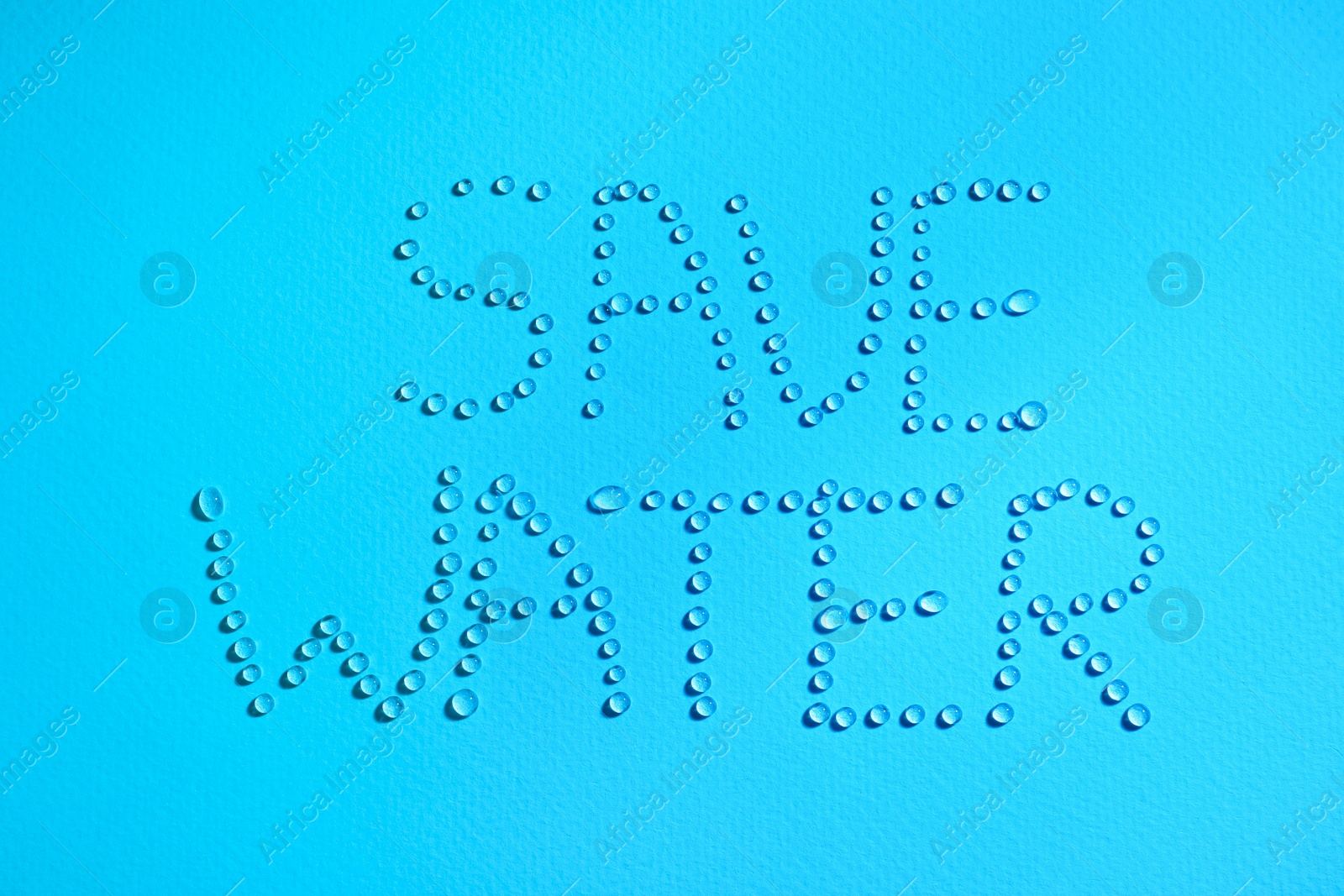 Photo of Inscription Save Water made of drops on light blue background, top view