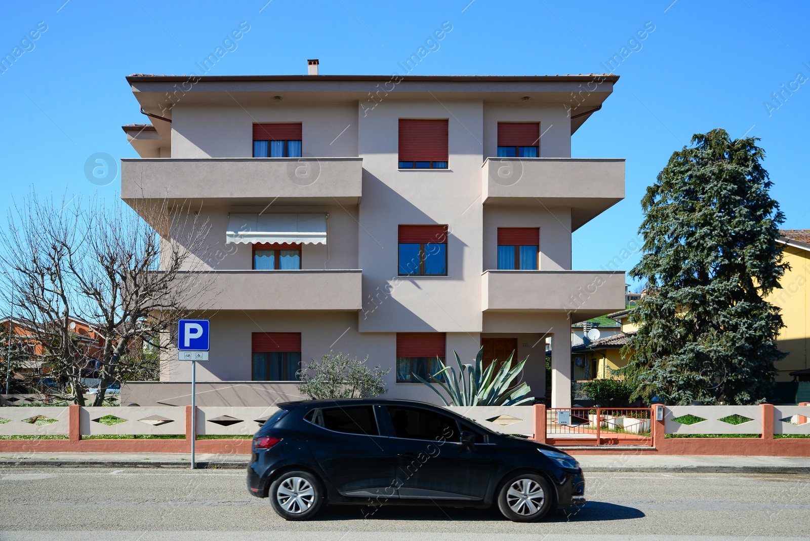 Photo of Beautiful view of car and stylish building on sunny day