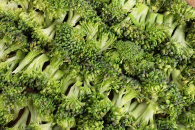 Fresh raw broccoli as background, top view