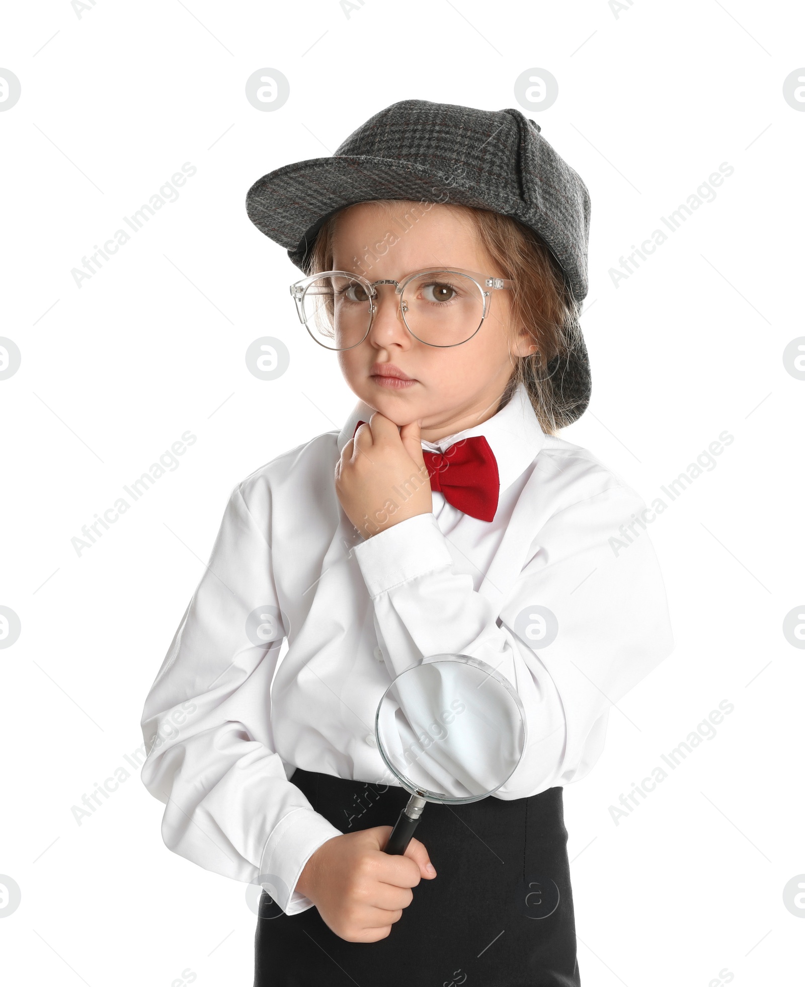 Photo of Cute little child in hat with magnifying glass playing detective on white background