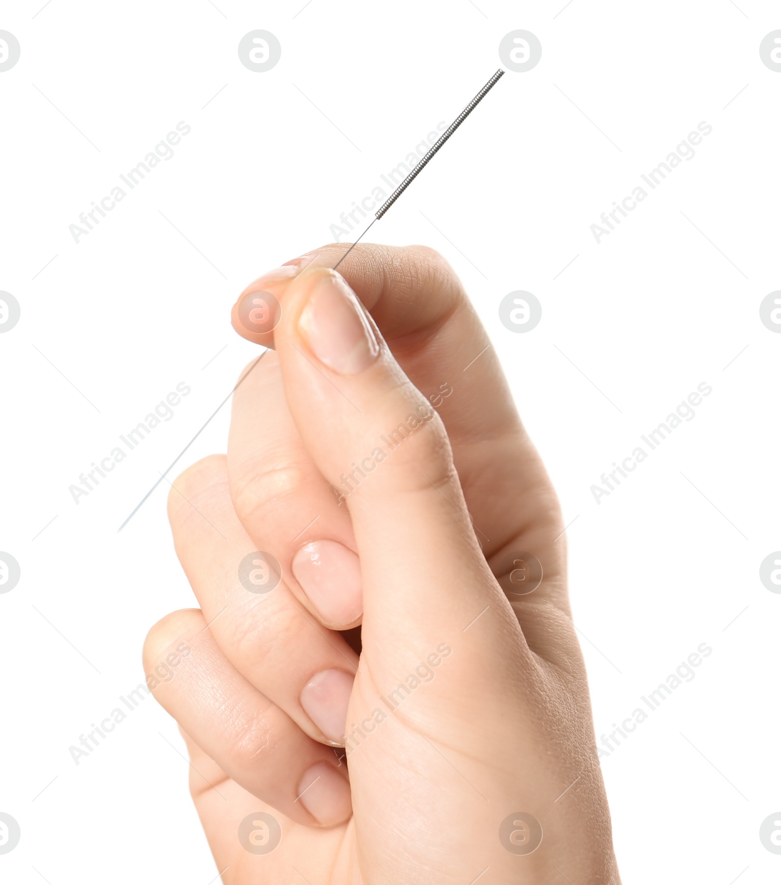 Photo of Woman holding needle for acupuncture on white background, closeup