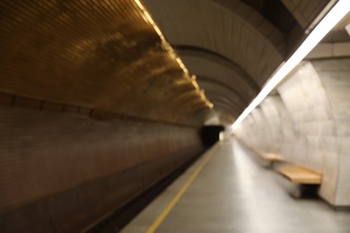 Photo of Blurred view of subway station. Public transport