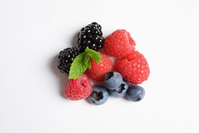 Photo of Raspberries, blackberries and blueberries on white background