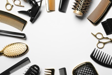 Photo of Frame of hairdressing tools on white background, flat lay. Space for text