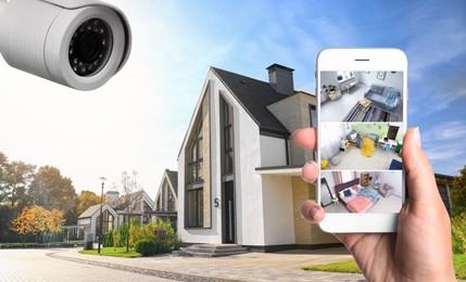 Image of Home security system. Woman monitoring CCTV cameras on smartphone near her house, closeup