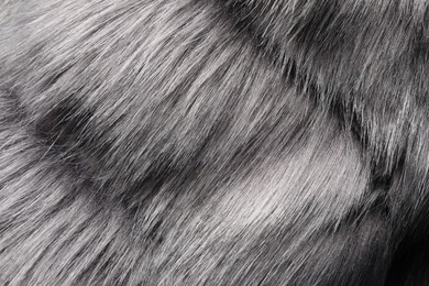 Photo of Texture of grey faux fur as background, closeup