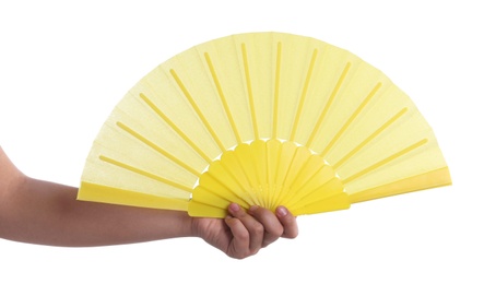 Photo of Woman holding yellow hand fan on white background, closeup