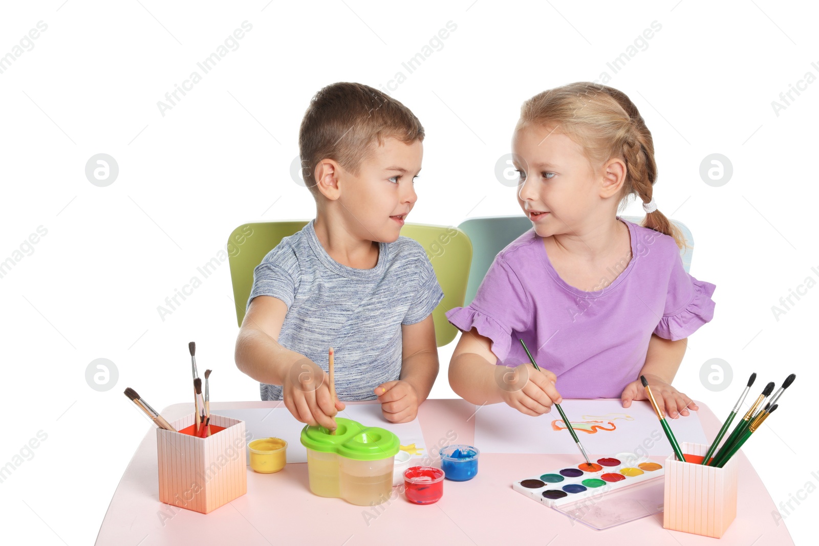 Photo of Cute children painting picture at table on white background