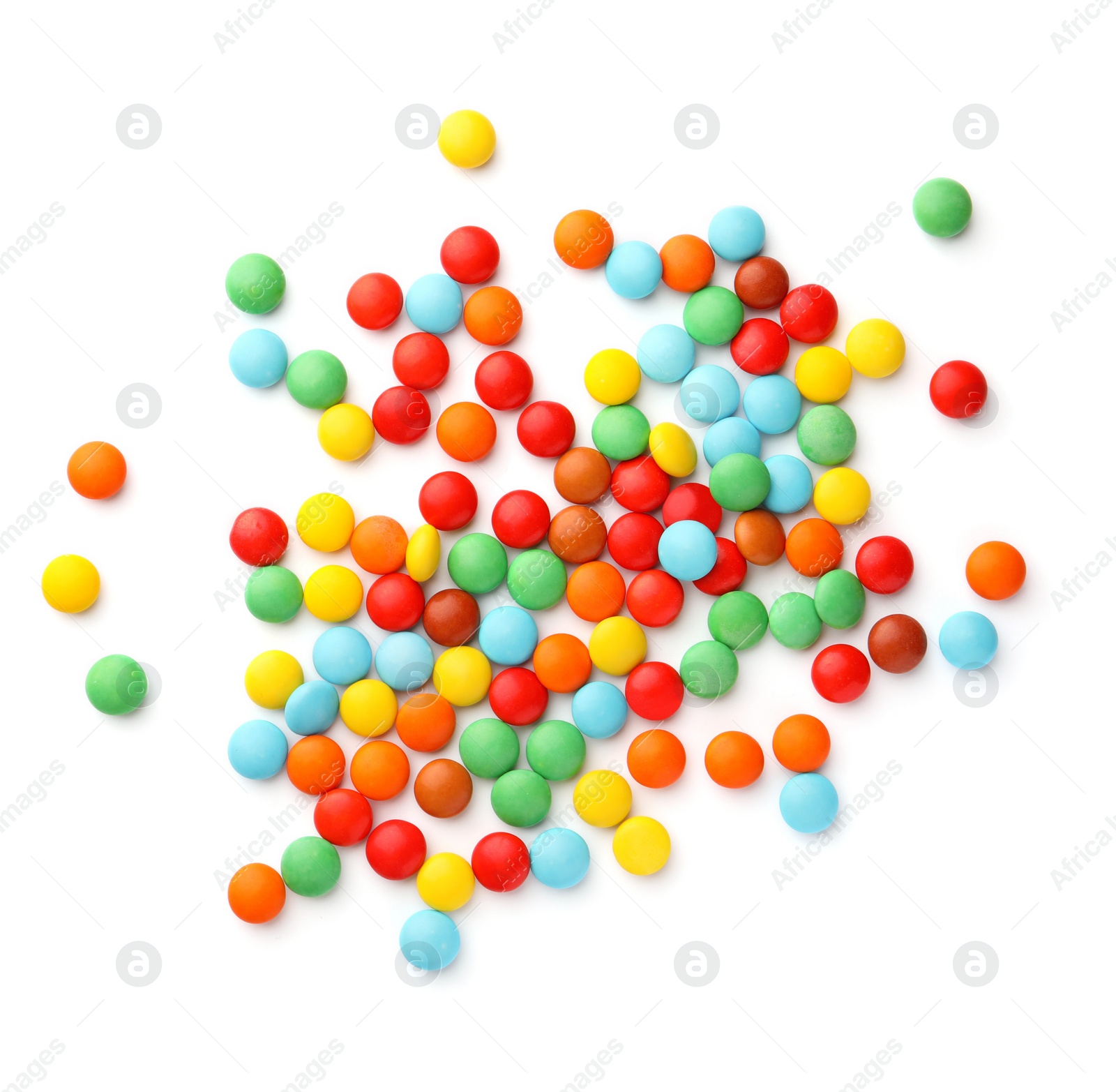 Photo of Many small colorful candies on white background, top view