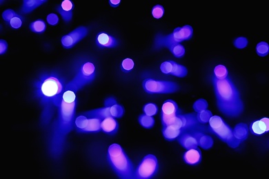 Photo of Beautiful colorful lights on dark background. Bokeh effect