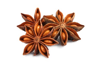 Dry anise stars with seeds on white background