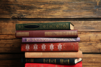 Collection of different books on wooden background