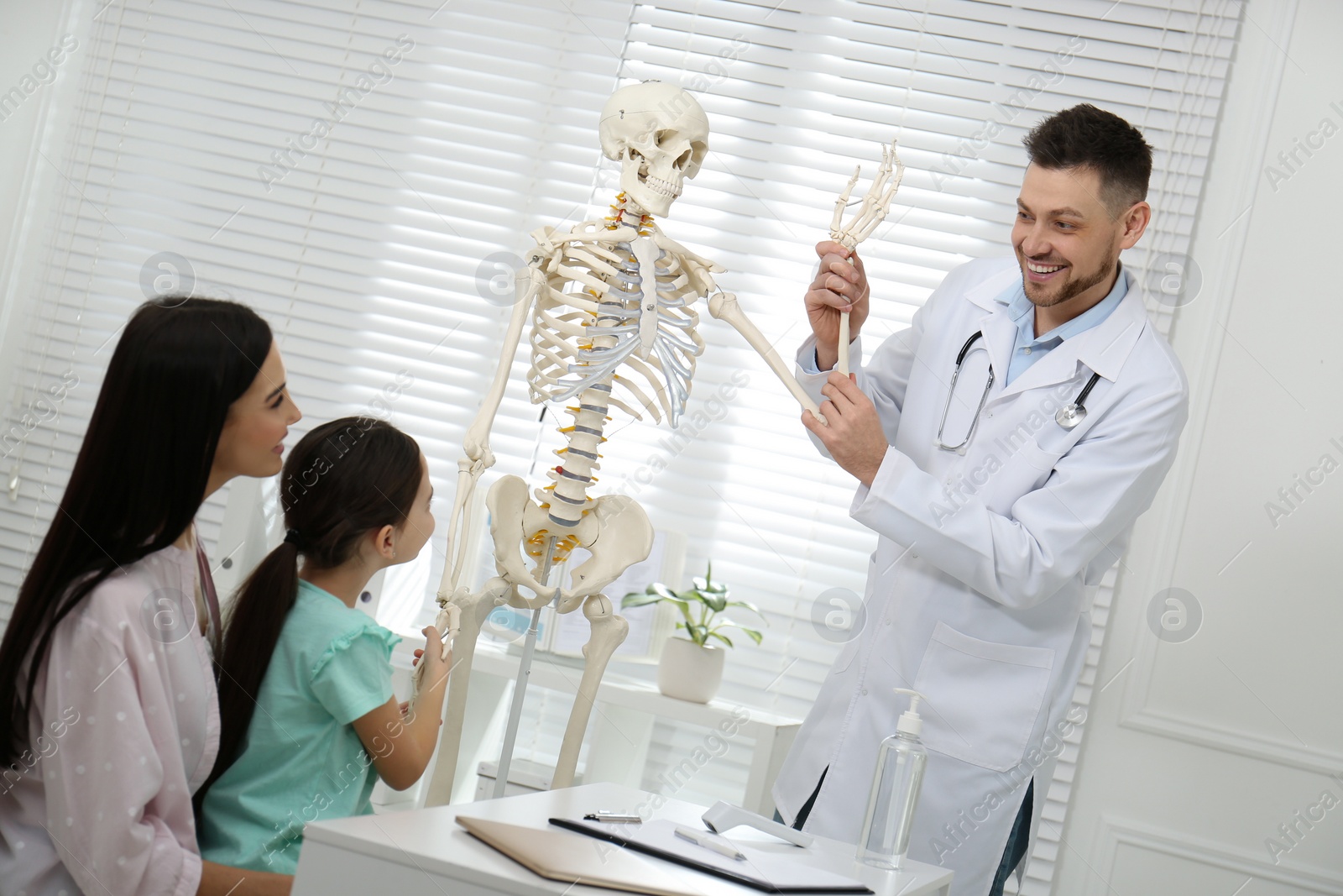 Photo of Mother with daughter visiting pediatrician in hospital