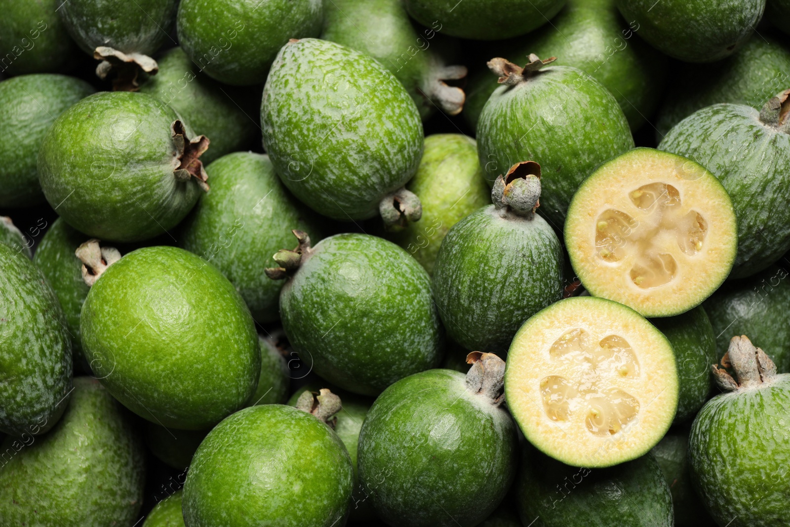 Photo of Fresh green feijoa fruits as background, closeup