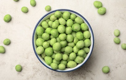 Photo of Tasty wasabi coated peanuts on table, flat lay