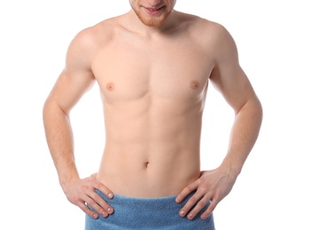 Young man with slim body in towel on white background, closeup