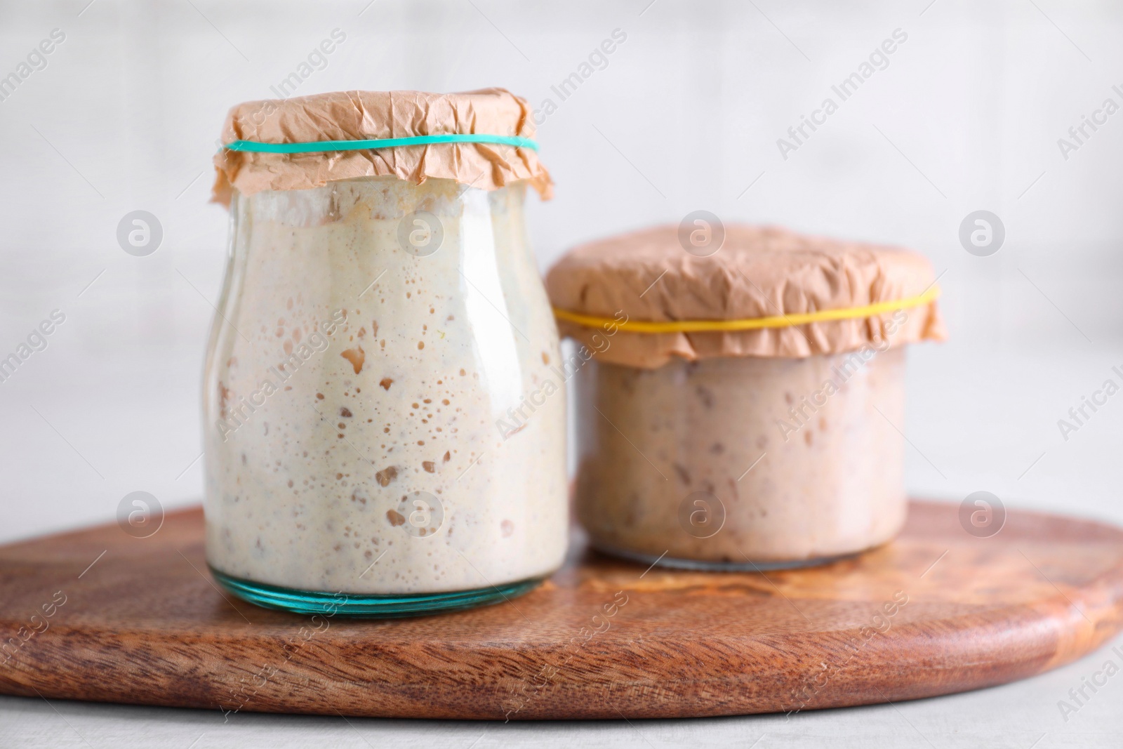 Photo of Sourdough starter in glass jars on table