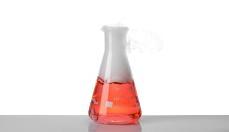 Laboratory flask with colorful liquid and steam isolated on white. Chemical reaction