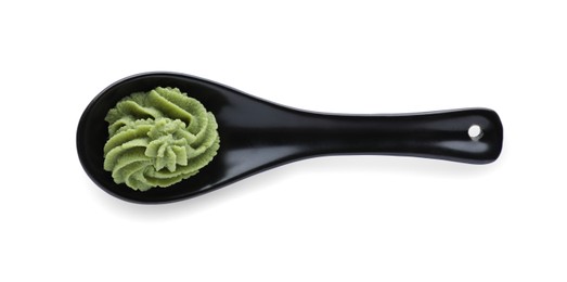 Photo of Ceramic spoon with swirl of wasabi paste isolated on white, top view