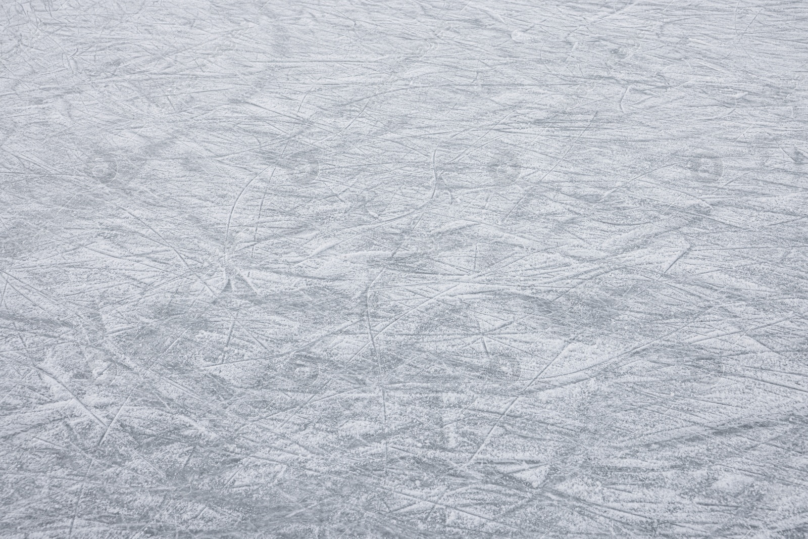 Photo of Frozen ice skating surface as background. Winter season