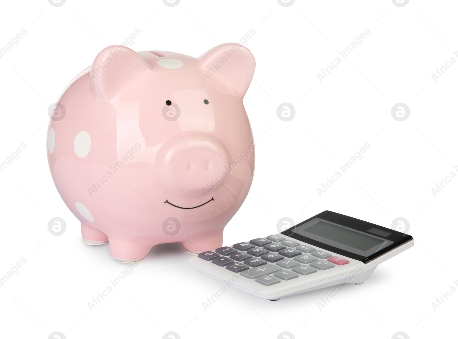 Photo of Piggy bank and calculator isolated on white