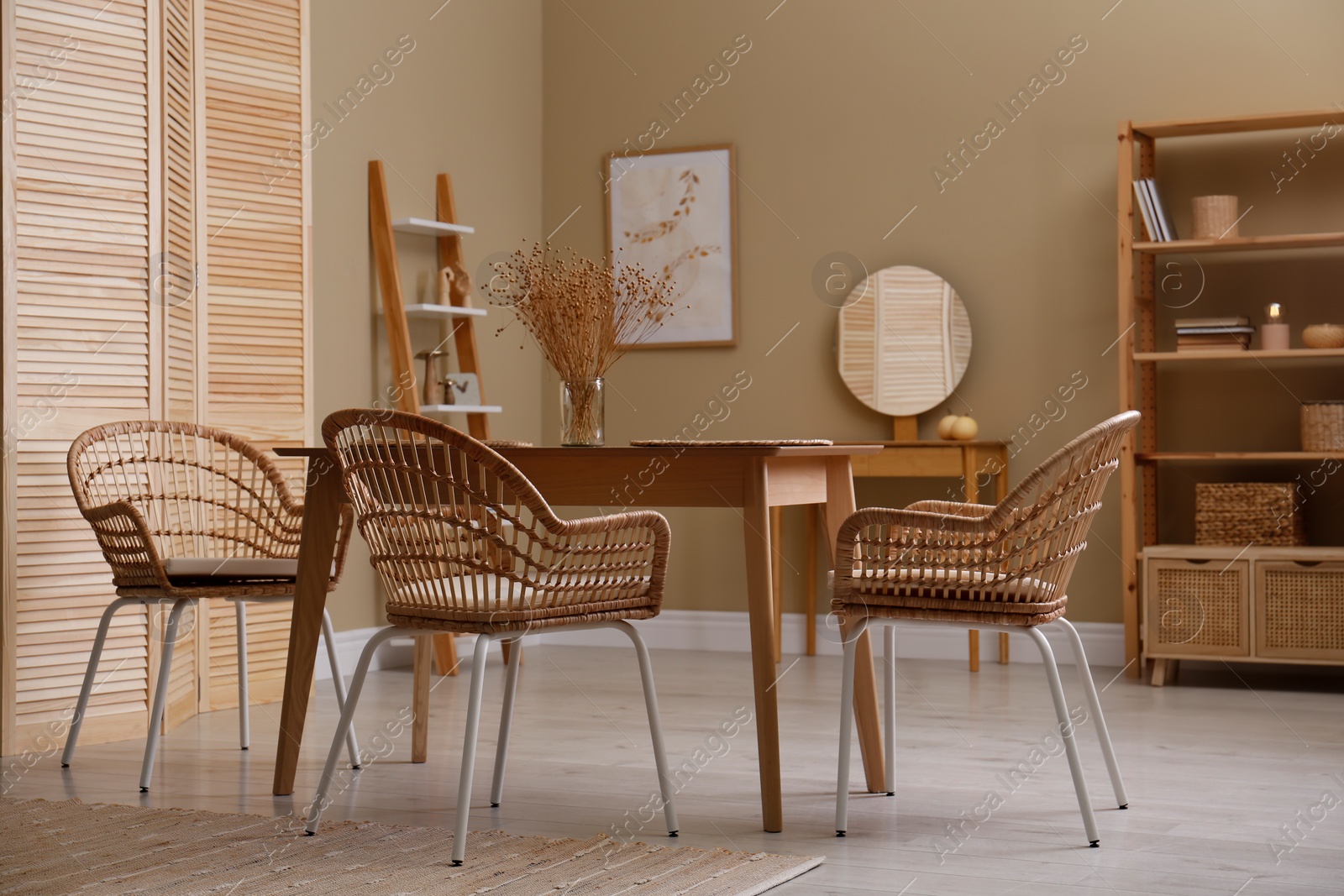 Photo of Beautiful dining room interior with new stylish furniture