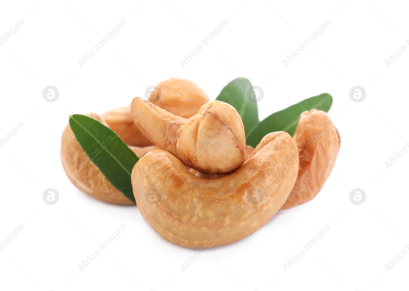 Photo of Tasty organic cashew nuts and green leaves isolated on white