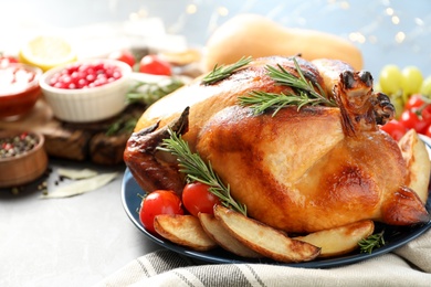 Delicious roasted turkey for traditional festive dinner on table