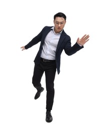 Photo of Businessman in suit posing on white background, low angle view