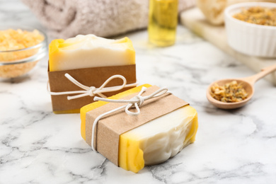 Photo of Natural handmade soap bars on marble table