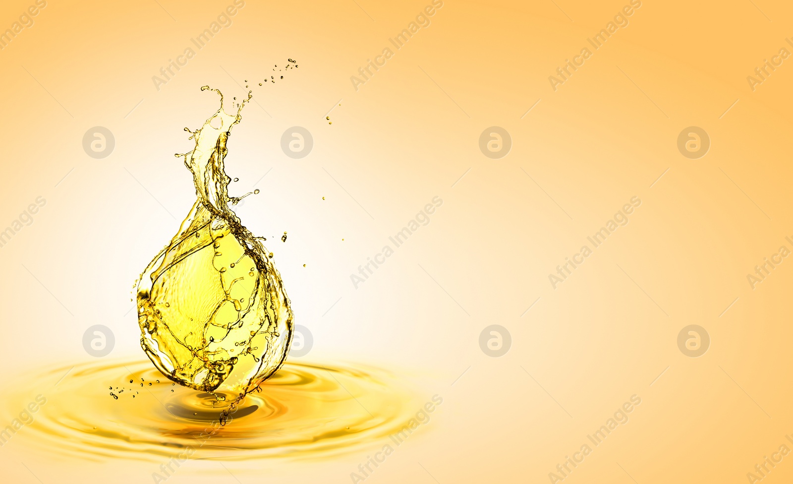 Image of Drop of cooking oil falling into oil on orange gradient background. Banner design with space for text